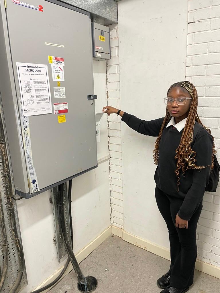 Year 9 student at Shenley Brooke End School inspecting a generation meter