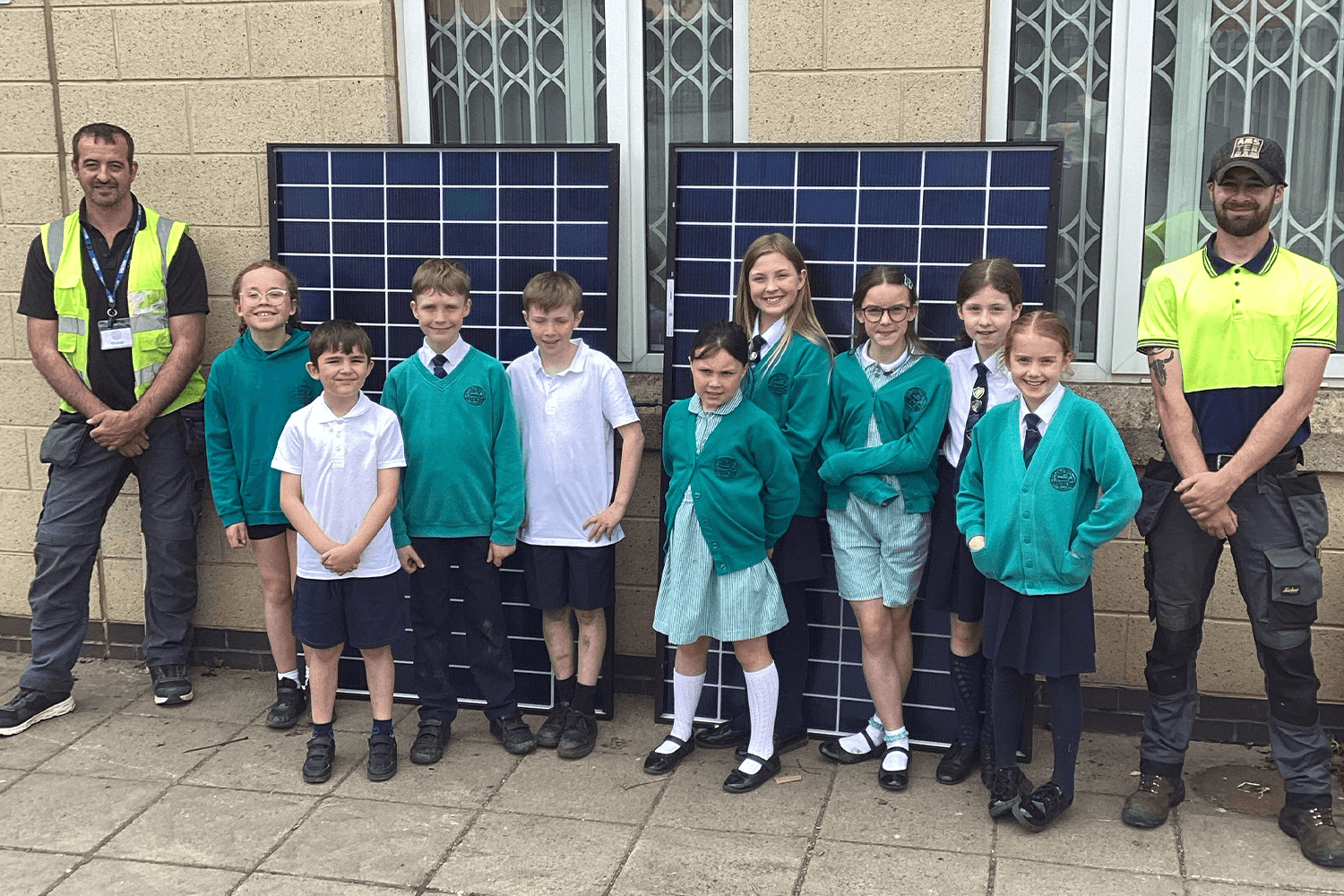 students with panels and installers